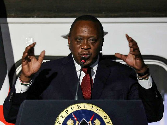 Kenyan President Uhuru Kenyatta speaks as he gives a joint statement with the French presi