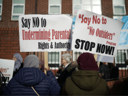 BIRMINGHAM, ENGLAND - MARCH 21: Parents and protestors demonstrate against the 'No Outsiders' programme, which teaches children about LGBT rights, at Parkfield Community School on March 21, 2019 in Birmingham, England. on March 21, 2019 in Birmingham, England. The School had agreed with parents to stop teaching the No Outsiders …