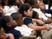 Manhattan Charter School students watch the National Address to Students on Educational Success by U.S. President Barack Obama September 8, 2009 in New York City. U.S. Secretary of State Hillary Rodham Clinton spoke to students beforehand at a "My Education, My Future" event at the school. (Photo by Mario Tama/Getty …