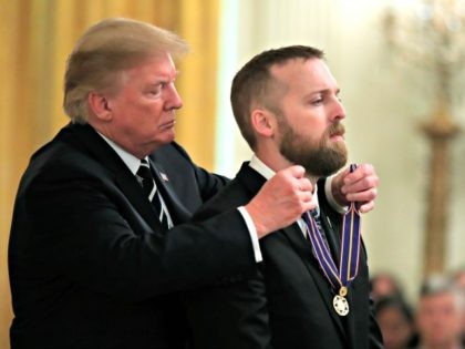 President Donald Trump awards Senior Trooper Nicholas Cederberg of the Oregon State Police, the Public Safety Officer Medal of Valor during a ceremony in the East Room of the White House in Washington, Wednesday, May 22, 2019. (AP Photo/Manuel Balce Ceneta)