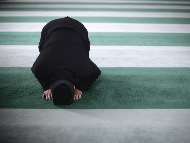 LONDON, ENGLAND - FEBRUARY 18: A Muslim man prays at Baitul Futuh Mosque in Morden on Febr