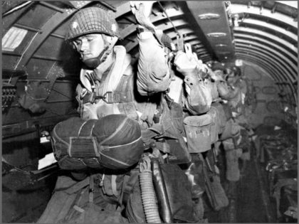 US paratroopers fix their static lines before a jump over Normandy on D-Day.AP Photo/U.S. Army Signal Corps