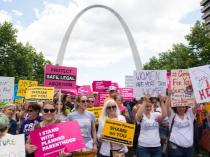 Thousands of demonstrators march in support of Planned Parenthood and pro-choice as they protest a state decision that would effectively halt abortions by revoking the license of the last center in the state that performs the procedure, during a rally in St. Louis, Missouri, May 30, 2019. (Photo by SAUL …