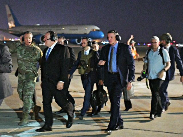 US Secretary of State Mike Pompeo (2nd L) and Lt General Paul LeCamera (L) make their way