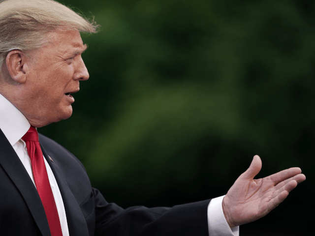 U.S. President Donald Trump talks to journalists as he departs the White House for a campa