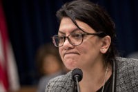 Representative Rashida Tlaib, a Democrat from Michigan, pauses while questioning Tim Sloan, president and chief executive officer of Wells Fargo & Co., not pictured, during a House Financial Services Committee hearing in Washington, D.C., U.S., on Tuesday, March 12, 2019. Wells Fargo & Co. stock is underperforming Tuesday pre-market as …