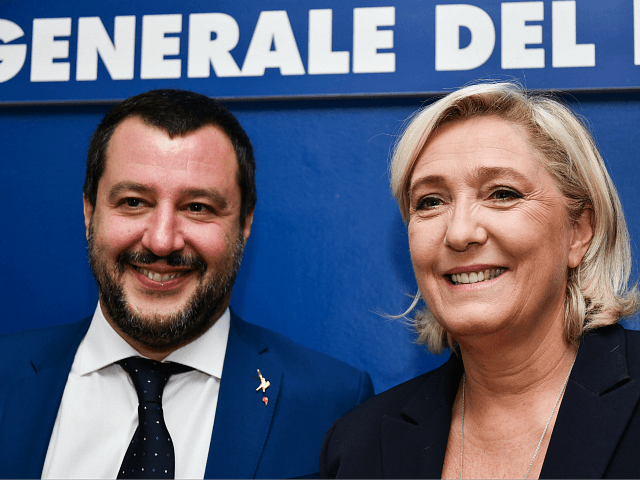 Italy's Interior Minister, Matteo Salvini (L) and leader of France's far-right National Rally (RN) party, Marine Le Pen pose upon their arrival to attend a debate on the theme "Economic growth and social prospects in a Europe of Nations" on October 8, 2018 at the headquarters of the Unione Generale …