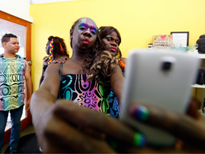 SYDNEY, AUSTRALIA - MARCH 04: Members of the Tiwi Islands transgender community prepare ahead of the Sydney Gay and Lesbian Mardi Gras parade on March 4, 2017 in Sydney, Australia. After a successful crowd funding campaign, a group of 30 transgender women from the remote Northern Territory Tiwi Islands travelled …