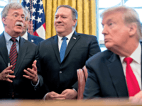 From left, National Security Adviser John Bolton, accompanied by Secretary of State Mike Pompeo, and President Donald Trump, speaks before Trump signs a National Security Presidential Memorandum to launch the "Women's Global Development and Prosperity" Initiative in the Oval Office of the White House in Washington, Thursday, Feb. 7, 2019. …