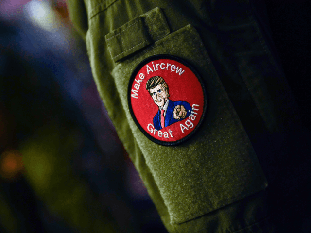 A US Marine wearing a badge listens to US President Donald Trump during a Memorial Day event aboard the amphibious assault ship USS Wasp (LHD 1) in Yokosuka on May 28, 2019. (Photo by Brendan SMIALOWSKI / AFP) (Photo credit should read BRENDAN SMIALOWSKI/AFP/Getty Images)