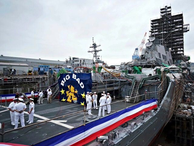 The USS John S. McCain under repair at a dry dock is seen after a rededication ceremony fo