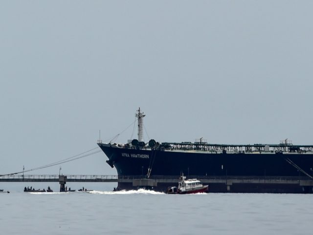 An oil tanker remains at the Maracaibo Lake in Maracaibo, Venezuela on March 15, 2019. - Production cutbacks by OPEC nations are building a supply cushion that could be called upon to mitigate a possible supply shock from an abrupt drop in crisis-hit Venezuela's output, the International Energy Agency (IEA) …