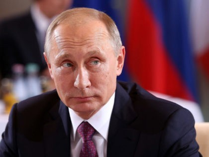 Russian President Vladimir Putin attends a meeting to discuss the Ukrainian peace process