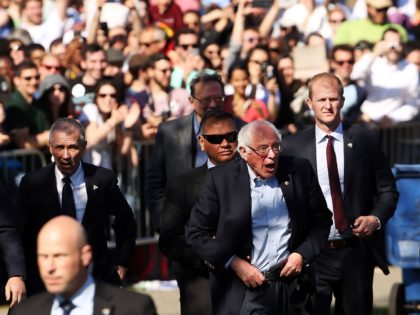 Democratic Presidential candidate Bernie Sanders walks with members of his family before s