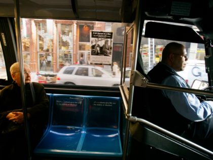 A seat sits vacant behind the bus driver on a New York City public bus in honor of civil r