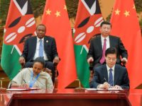 Chinese President Xi Jinping (top R) and Kenyan President Uhuru Kenyatta (top L) attend a signing ceremony after their bilateral meeting during the Belt and Road Forum for International Cooperation at the Great Hall of the People in Beijing on May 15, 2017. / AFP PHOTO / POOL / Etienne …