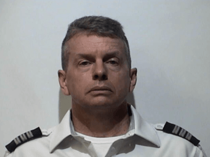 Christian "Kit" Richard Martin, 51, was arrested early Saturday at the Louisville airport by authorities with the U.S. Marshall's Service, Christian County Sheriff's Office and Louisville Metro Police Department, according to Kentucky Attorney General Andy Beshear's office.
