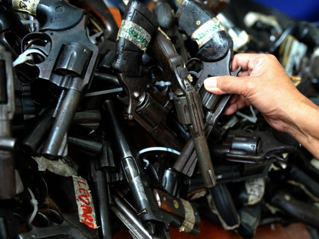 Confiscated loose firearms are presented to the media during a press briefing at the headquarters of the Philippine National Police (PNP) in Quezon City, suburban Manila on August 17, 2009. PNP Director General Jesus Versoza said at a gun control press briefing, over one million unlicensed firearms are in the …