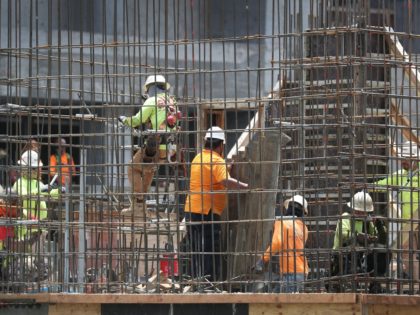 MIAMI, FLORIDA - MAY 03: Construction workers are seen at work on May 03, 2019 in Fort Lau