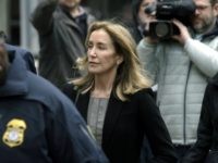Felicity Huffman arrives at federal court Monday, May 13, 2019, in Boston, where she is scheduled to plead guilty to charges in a nationwide college admissions bribery scandal. (AP Photo/Steven Senne)