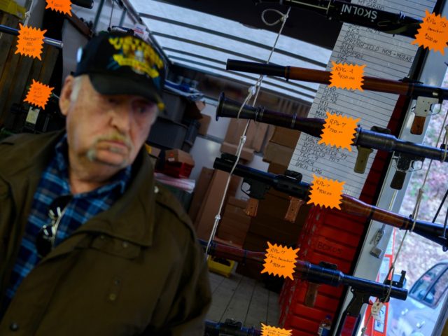 A man walks past a vendor selling inactive Rocket Propelled Grenades (RPGs) at the Knob Creek Machine Gun Shoot and Military Gun show in Bullitt County near West Point, Kentucky on April 12, 2019. - The Machine Gun Shoot and Military Gun show attracts thousands of visitors from across the …