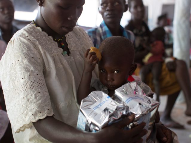 A young girl is given food supplements at a World Food Programme, (WFP) nutritional screen