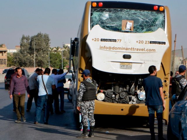 A picture taken on May 19, 2019, shows a bus damaged during a bomb blast near Egypt's famed Giza pyramids. - A bomb blast hit a tourist bus wounding at least 17 people, including South Africans, in the latest blow to the country's tourism industry. The roadside bomb went off …