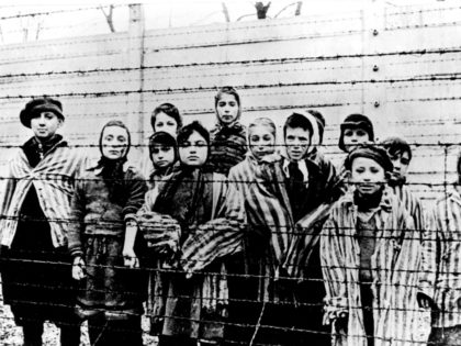 The file picture taken just after the liberation by the Soviet army in January, 1945 shows a group of children wearing concentration camp uniforms including Martha Weiss who was ten years-old, 6th from right, at the time behind barbed wire fencing in the Oswiecim (Auschwitz) Nazi concentration camp. The German …