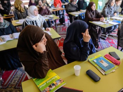 HALLE, GERMANY - FEBRUARY 14: Muslim women from Syria take part in a German lesson in the Muslim cultural center and mosque as Aydan Ozoguz (not pictured), German Federal Commissioner for Immigration, Refugees and Integration visits the center and mosque following a recent attack on February 14, 2018 in Halle …