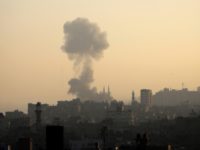 Smoke billows above buildings in Gaza City during an Israeli airstrike on the Palestinian enclave on May 5, 2019. - Gaza militants fired fresh rocket barrages at Israel early today in a deadly escalation that has seen Israel respond with waves of strikes as a fragile truce again faltered and …