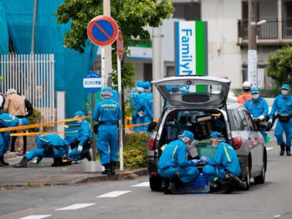 Police forensic experts work at the crime scene where a man stabbed 19 people, including children in Kawasaki on May 28, 2019. - A knife-wielding attacker killed a 12-year-old schoolgirl and a man before stabbing himself to death in a rampage outside Tokyo on May 28 that also injured more …