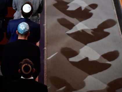 Men wearing Jewish kippa skullcaps attend a ceremony at the Synagogue Rykestrasse in Berlin on November 9, 2018 to commemorate the 80th anniversary of the Kristallnacht Nazi pogrom. - Germany remembers victims of the Nazi pogrom that heralded the start of the Third Reich's drive to wipe out Jews, at …