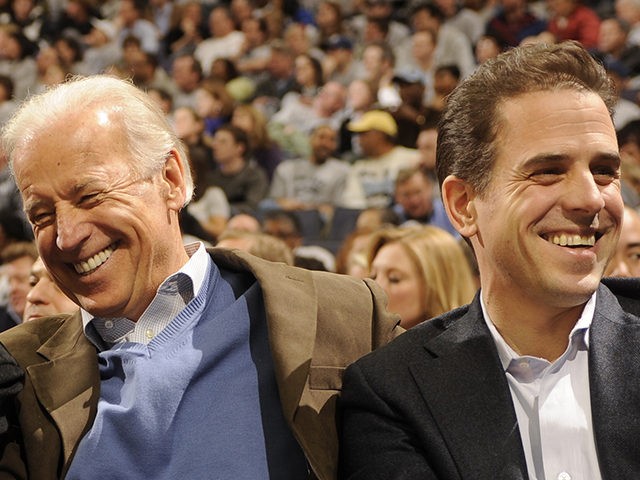 WASHINGTON - JANUARY 30: President of the United States Barack Obama and Vice President Joe Biden and Hunter Biden (son of Joe Biden) talk during a college basketball game between Georgetown Hoyas and the Duke Blue Devils on January 30, 2010 at the Verizon Center in Washington DC. (Photo by …
