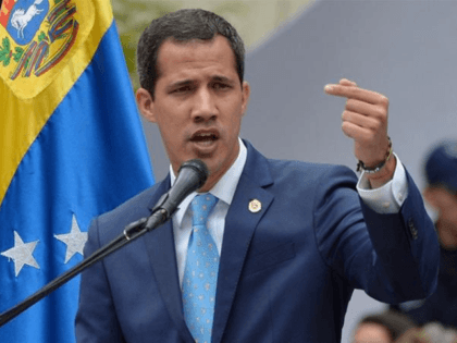 Venezuelan opposition leader and self-proclaimed interim president Juan Guaido addresses supporters during a meeting in Caracas [Federico Parra/AFP]