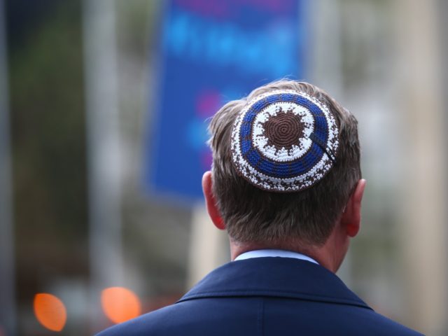 Thuringia's State Premier Bodo Ramelow wears a kippa during a rally in Erfurt, central Ger