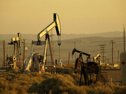 Oil rigs pump at sunrise on August 4, 2004 north of the Los Padres National Forest, California. The Bush administration is pushing to undo a Clinton-era decision that put 58.5 million acres of national forests off-limits to development, especially in road-less areas. The new plan would allow the nation's governors …