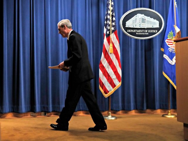 Special counsel Robert Mueller walks from the podium after speaking at the Department of J