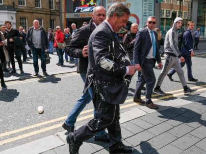 Brexit Party leader Nigel Farage has what is thought to have been a milkshake thrown over him as he visits Northumberland Street in Newcastle Upon Tyne during a whistle stop UK tour on May 20, 2019 in Newcastle Upon Tyne, England. His visit to Newcastle comes ahead of the 2019 …