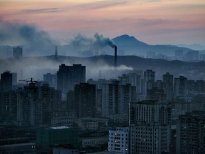 A view of the North Korean capital Pyongyang shows huge steam clouds from coal powered pow