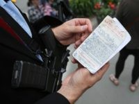 SEATTLE, WA - MAY 20: Mark Callahan, who is running for a legislative position in Oregon carries an AR556 semi automatic rifle and a copy of the U.S. Constitution during a Open Carry guns rights rally on May 20, 2018 in Seattle, Washington. (Photo by Karen Ducey/Getty Images)