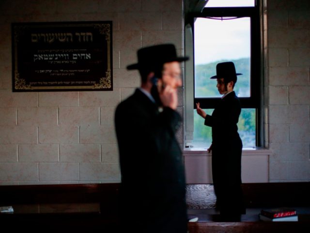 TOPSHOT - Orthodox Jews of the Satmar Hasidim arrive to celebrate the Jewish holiday of La