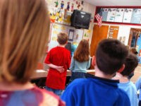 WARMINSTER, PA - MARCH 24: First graders at Longstreth Elementary School pledge allegiance to the flag March 24, 2004 in Warminster, Pennsylvania. An atheist parent, Michael Newdow, of Sacramento, California is scheduled to be heard by the Supreme Court today to defend his position that the "Under God" in the …