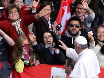 VATICAN CITY, VATICAN - MARCH 27: Pope Francis waves to the crowd from an open-air jeep, ahead of his first weekly general audience, in St Peter's Square on March 27, 2013 in Vatican City, Vatican. (Photo by Franco Origlia/Getty Images)