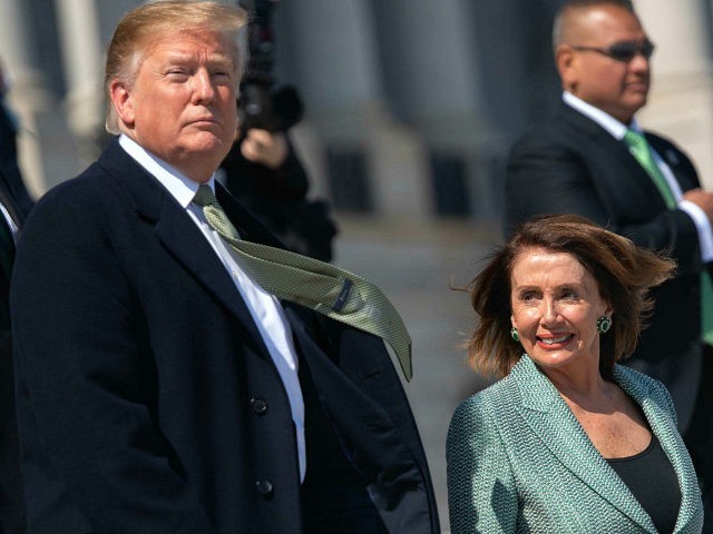 US President Donald Trump walks alongside Speaker of the House Nancy Pelosi as he departs following the Friends of Ireland Luncheon in honor of Irish Prime Minister Leo Varadkar at the US Capitol in Washington, DC, March 14, 2019. (Photo by SAUL LOEB / AFP) (Photo credit should read SAUL …