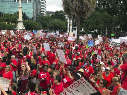 Thousands gather at the South Carolina Statehouse Wednesday, May 1, 2019, for a rally call