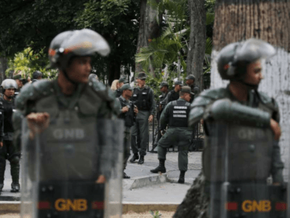 Venezuelan Bolivarian National stand guard around the National Assembly building as the opposition-controlled congress met to discuss a move could provide political cover for greater international involvement in the nation's crisis, in Caracas, Venezuela, Tuesday, May 7, 2019. Military police prevented journalists from entering the National Assembly, and some reporters …