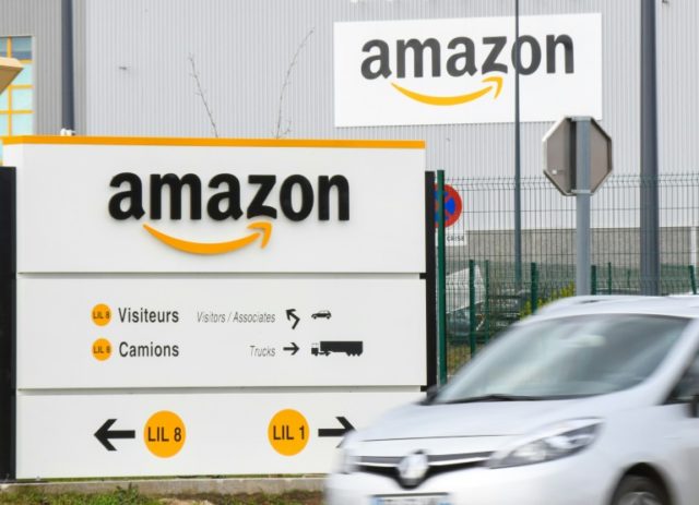 The Amazon logo at one of the e-commerce company's logistics centers in France '.Amazon' gives e-commerce giant its own internet domain