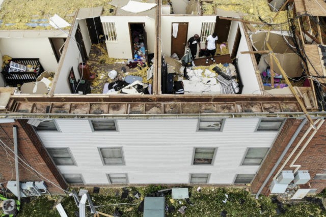 APTOPIX Severe Weather Ohio Residents sort through apartments open up to the air Tuesday, May 28, 2019, at the Westbrooke Village Apartments in Trotwood, Ohio, after the roof was torn off from a severe storm the night before. (AP Photo/John Minchillo) The Associated Press