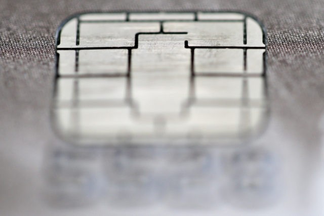 Global Payments Total System Services FILE This June 10, 2015, file photo shows a chip credit card in Philadelphia. Global Payments is buying Total System Services in an all stock deal valued at $21.5 billion, the third major acquisition in the payment processing sector this year. (AP Photo/Matt Rourke, File) The Associated Press