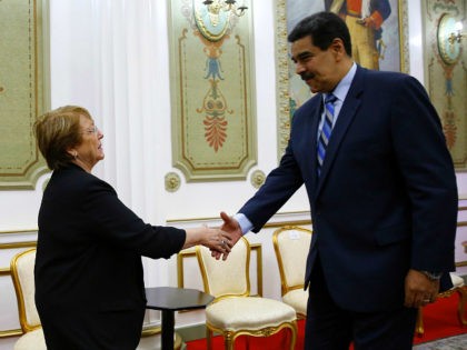 U.N. High Commissioner for Human Rights Michelle Bachelet, left, is greeted by Venezuela's President Nicolas Maduro, at Miraflores Presidential Palace, in Caracas, Venezuela, Friday, June 21, 2019. The United Nations' top human rights official is visiting Venezuela amid heightened international pressure on President Maduro. (AP Photo/Ariana Cubillos)